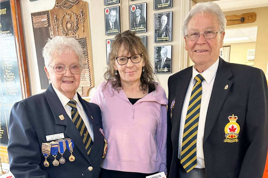 Vivian MacNeil, from left, Sheryl, Legion bartender, and Walt Cobb, Legion president stand with a few weeks worth of pull tabs. Photo contributed by Marg Bublitz